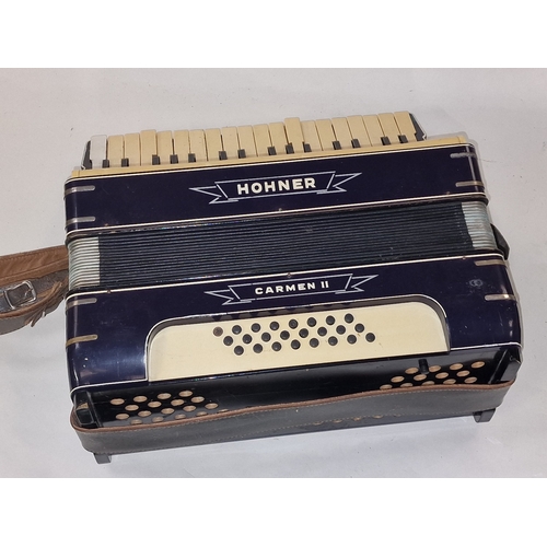 169 - Hohner Carmen II vintage piano accordion c/w original (very tatty) carrying case.