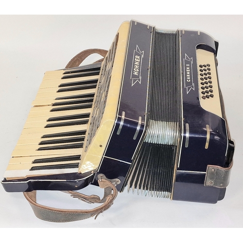 169 - Hohner Carmen II vintage piano accordion c/w original (very tatty) carrying case.