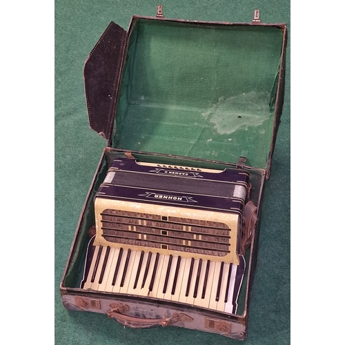 169 - Hohner Carmen II vintage piano accordion c/w original (very tatty) carrying case.