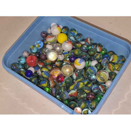 42 - A tub containing a good collection of marbles. Various sizes and designs.