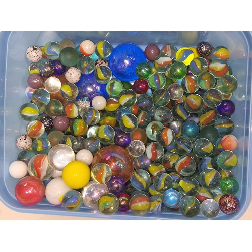 42 - A tub containing a good collection of marbles. Various sizes and designs.