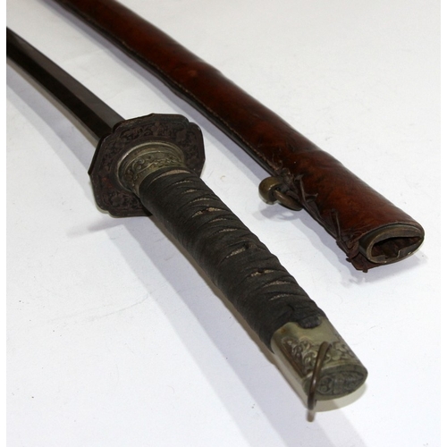 148 - Mid 20th century WWII era Shin Gunto Katana housed in a tan leather scabbard with a fabric wrapped r... 