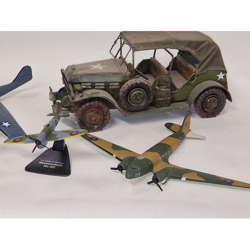 180 - Collection of various military airplane models to include Corgi together with an army jeep.