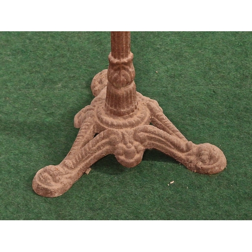 187 - Cast metal table base with circular top. Claw feet, fluted stem and collard column 70cm tall.