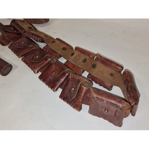 47 - Vintage leather ammunition belt together with a leather pistol holster belt.