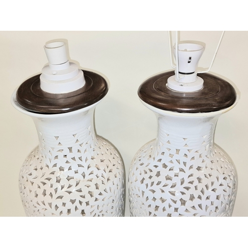 6 - Pair of large white reticulated porcelain lamp bases each measure approx 62cm tall. Includes a pair ... 