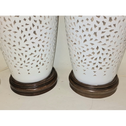 6 - Pair of large white reticulated porcelain lamp bases each measure approx 62cm tall. Includes a pair ... 