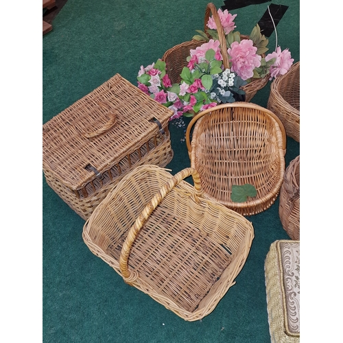 192 - A large collection of wicker baskets. Some vintage examples. Various sizes.