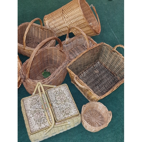 192 - A large collection of wicker baskets. Some vintage examples. Various sizes.