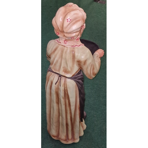 193 - Standing fibreglass model of an elderly lady holding a tray 100cm tall.