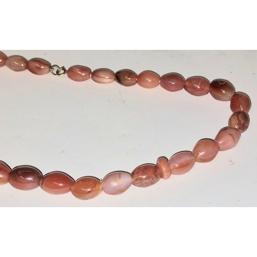 304 - Scottish carnelian agate necklace with 9ct gold clasp. 56cm total length.