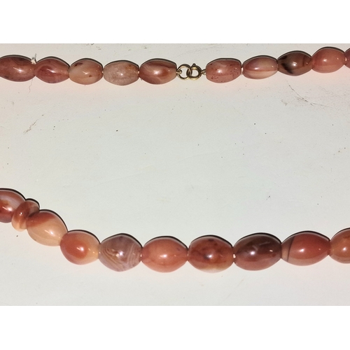 304 - Scottish carnelian agate necklace with 9ct gold clasp. 56cm total length.