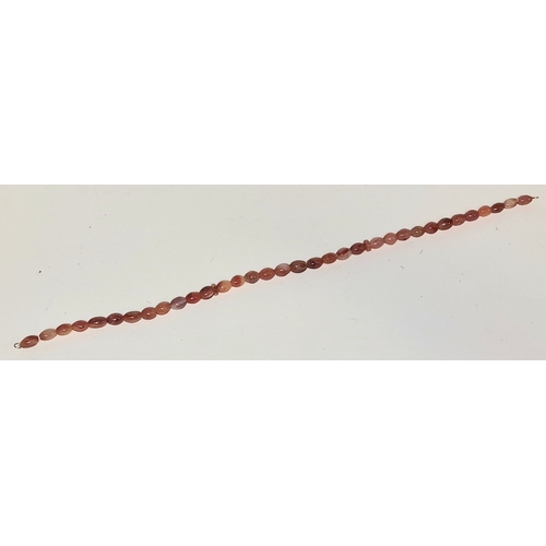 304 - Scottish carnelian agate necklace with 9ct gold clasp. 56cm total length.