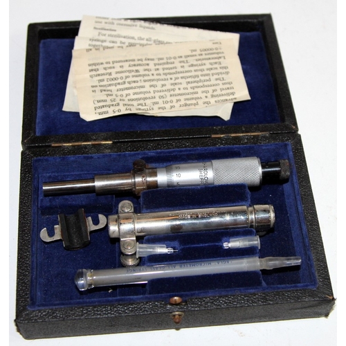 223 - Vintage medical equipment: Cased MPC straining nozzles, a stack of Griffin & Tatlock test sieves, a ... 