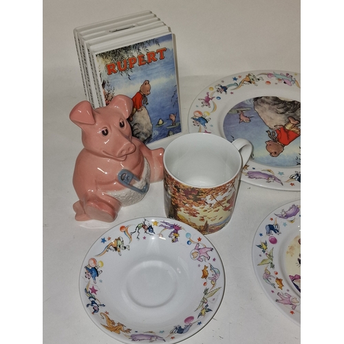 12 - Wedgwood Rupert Bear collection of ceramics to include a pair of book end money boxes together with ... 