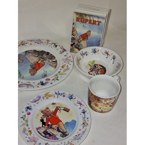 12 - Wedgwood Rupert Bear collection of ceramics to include a pair of book end money boxes together with ... 