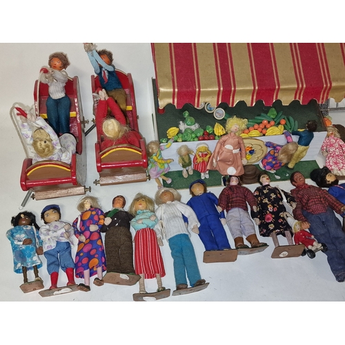 235 - Collection of vintage mid 20th century small handmade wooden dolls in fabric clothing together with ... 