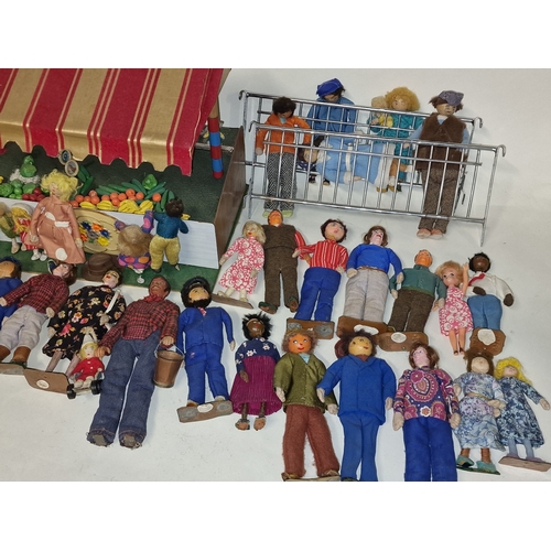 235 - Collection of vintage mid 20th century small handmade wooden dolls in fabric clothing together with ... 