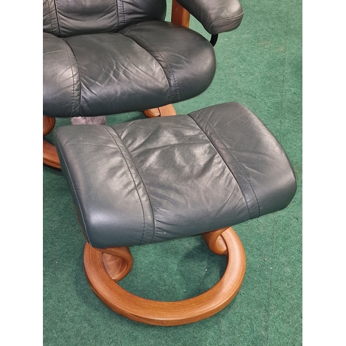 245 - Ekornes Stressless reclining leather armchair with matching footstool.