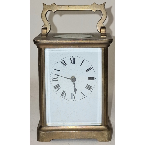 136 - Late 19th century French brass cased 8 day carriage clock with bevelled edged glass panels, ticking ... 