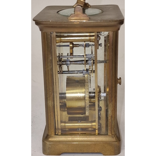 136 - Late 19th century French brass cased 8 day carriage clock with bevelled edged glass panels, ticking ... 