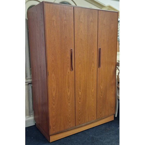 297 - G Plan Fresco vintage teak triple wardrobe fitted with single hanging rail. Cantilever folding doors... 