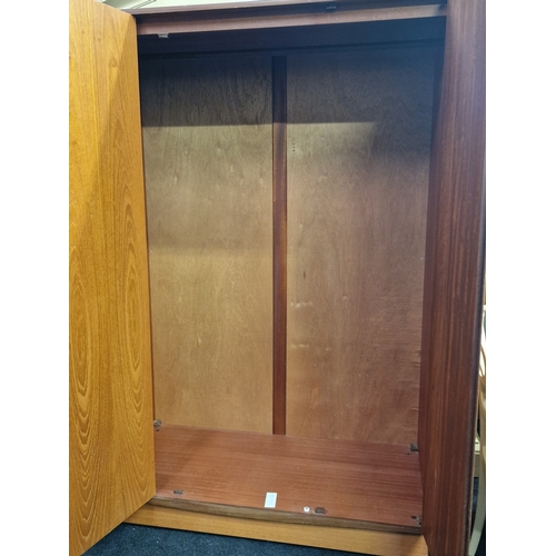 297 - G Plan Fresco vintage teak triple wardrobe fitted with single hanging rail. Cantilever folding doors... 