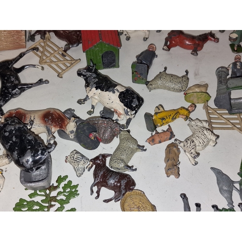 51 - Collection of Britains and other play worn farm animals and scenery.