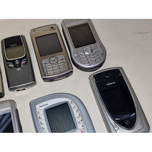 53 - Collection of vintage mainly Nokia mobile phones. 24 in total. A charger is also included.