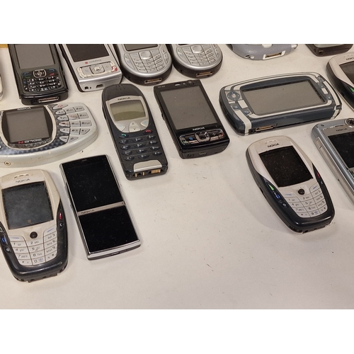 53 - Collection of vintage mainly Nokia mobile phones. 24 in total. A charger is also included.