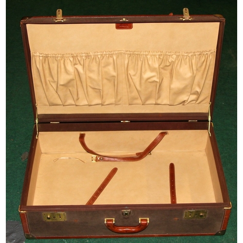 258 - Two vintage suitcases including a tan leather example by Olympa measuring 71cms x 43cms x 21cms