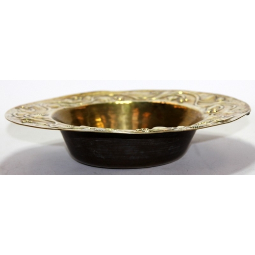 35 - Antique large brass bowl with repousse foliate decoration to flared rim. Possible signature to base.... 