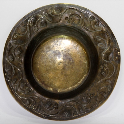 35 - Antique large brass bowl with repousse foliate decoration to flared rim. Possible signature to base.... 