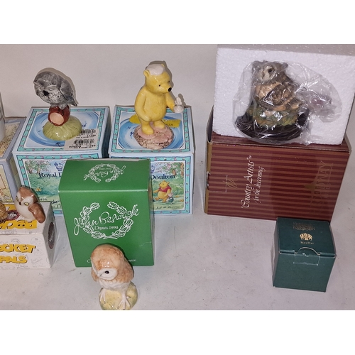 40 - Collection of boxed Royal Doulton, Beswick, Wade and other ceramics to include Winnie the Pooh, 101 ... 