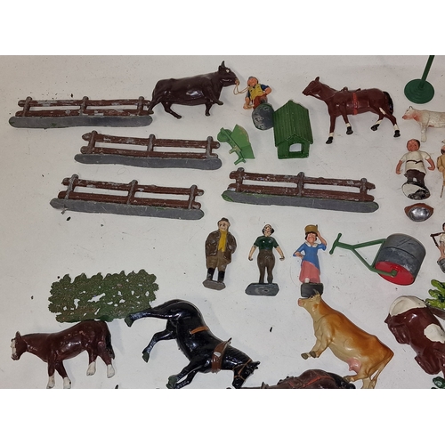 54 - A collection of vintage play worn lead farmyard animals and scenery to include Britains.