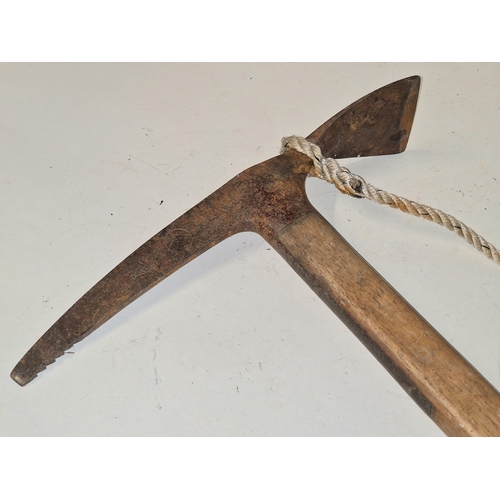 64 - An antique possibly early 20th century ice axe with oak handle. Makers stamp on head. 57cm in length... 