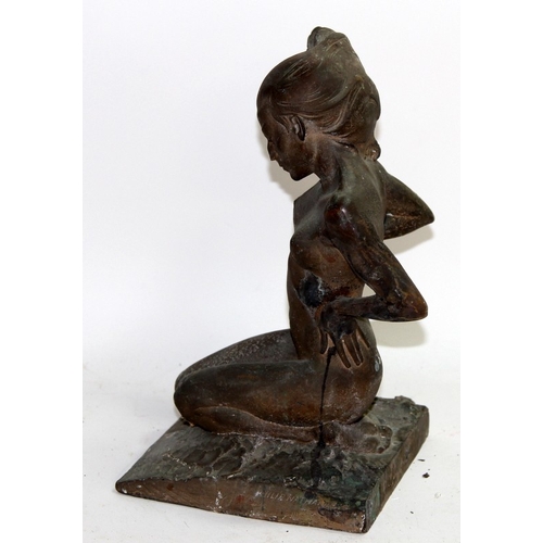 110 - Vintage cast metal figure of kneeling naked woman looking windswept and interesting. 30cms tall