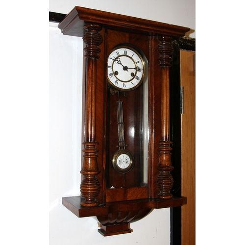 139 - Mahogany cased chiming wall clock with white enamel dial c/w key. working at time of listing