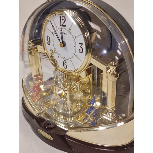 81 - Seiko Melodies in Motion QXW216G mantel clock. Clock and melodies working at time of listing. Includ... 