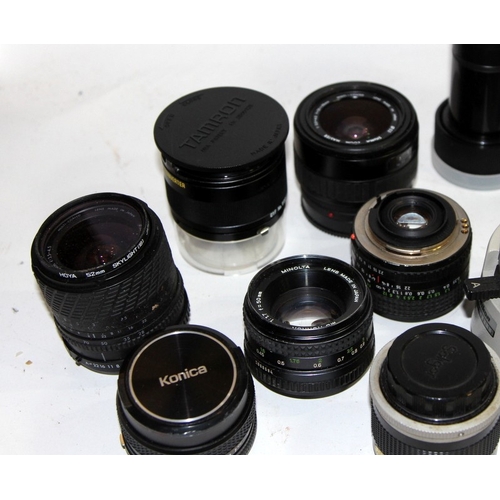 95 - A large collection  of vintage camera lenses and tele-converters, various brands and fittings