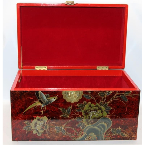 291 - Lacquerware storage box with Oriental style decoration and lined interior. 48cms x 27cms x 29cms