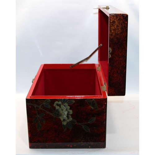 291 - Lacquerware storage box with Oriental style decoration and lined interior. 48cms x 27cms x 29cms