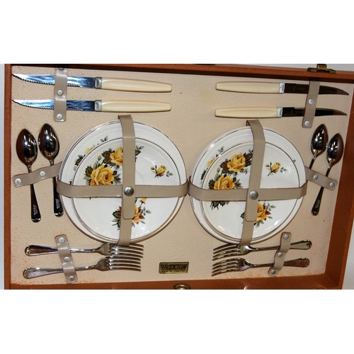 279 - Vintage mid-century  Brexton suitcase picnic set for four with china plates and two flasks. Appears ... 