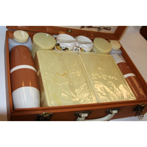 279 - Vintage mid-century  Brexton suitcase picnic set for four with china plates and two flasks. Appears ... 