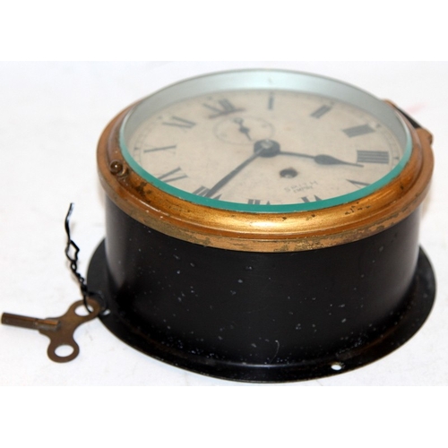 282 - Vintage Smith Empire ships bulkhead clock with key, ticks for a short while, requires attention. 18.... 