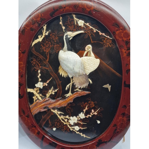 349 - Pair of oval Oriental oval wall decoration depicting wild Cranes fashioned from Mother of Pearl 56x4... 