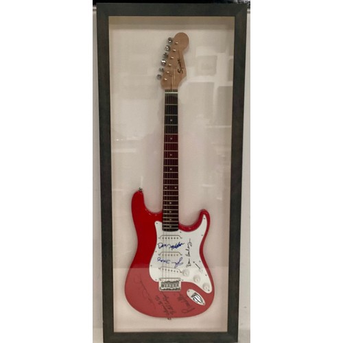 371 - THE EAGLES SIGNED AND FRAMED FENDER SQUIER STRATOCASTER ELECTRIC GUITAR. A very successful group who... 