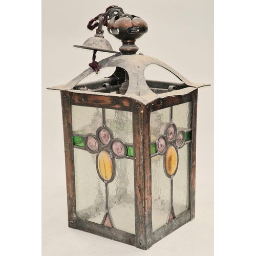 10 - An Arts & Crafts copper hanging lantern with stained glass tiffany style panels 35x19x19cm.