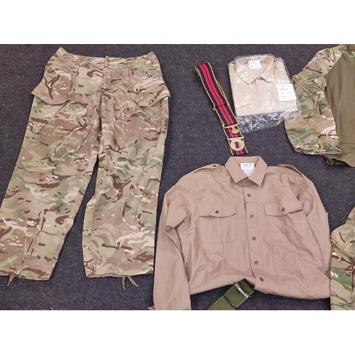 103 - Collection of British Army camo clothing to include new old stock shirt, belts, trousers etc.