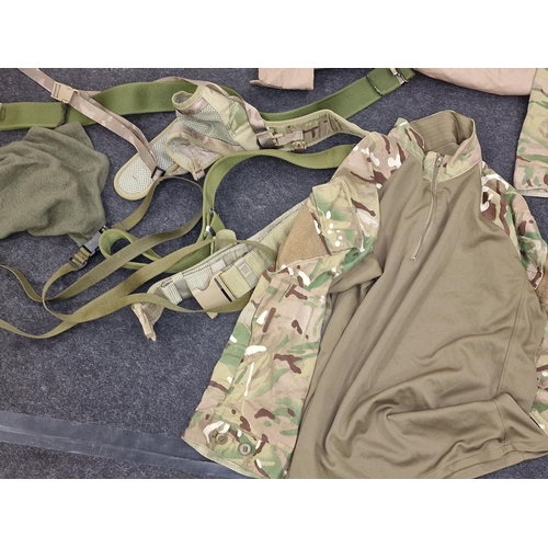 103 - Collection of British Army camo clothing to include new old stock shirt, belts, trousers etc.